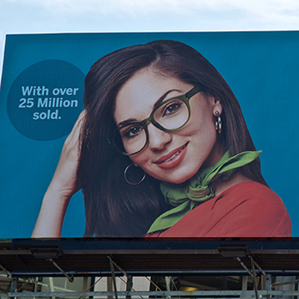 Woman in green glasses with the text: "With over 25 Million sold."