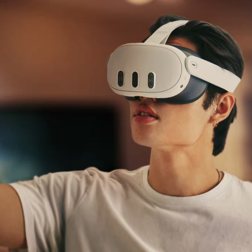 Person wearing a white and black VR headset.