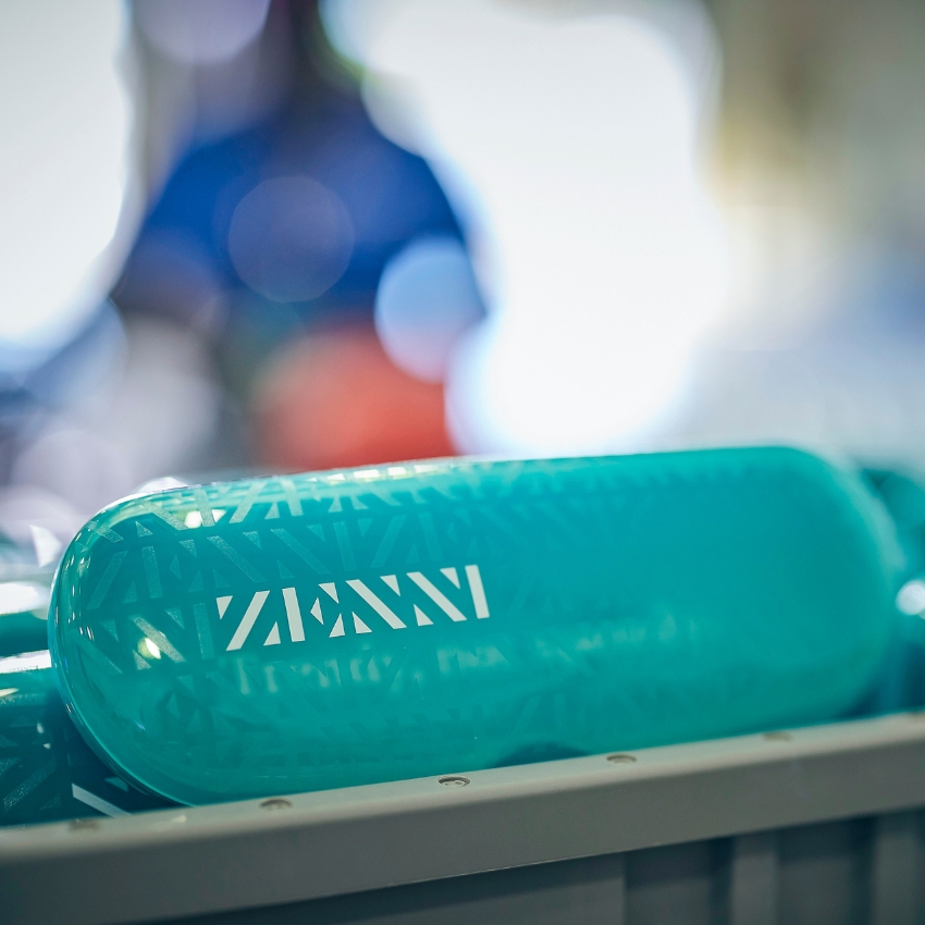 Turquoise glasses case with Zenni logo in white text