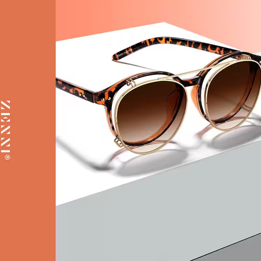 Zenni tortoiseshell sunglasses with round lenses and gold accents. Text: “ZENNI” on the left side.