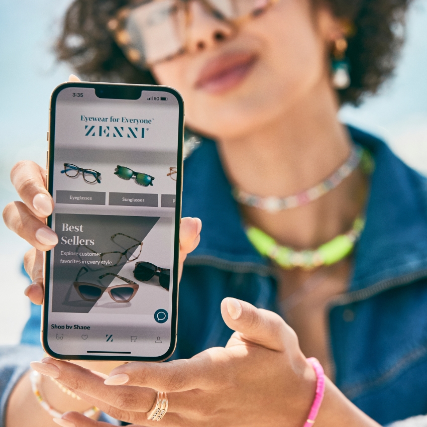 Smartphone screen showing Zenni website with categories for Eyeglasses, Sunglasses, and Best Sellers.