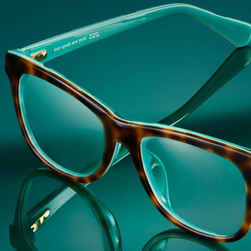 Tortoiseshell eyeglasses with teal inner frames and the text "kate spade new york CE Japan 521 56[]16-140".