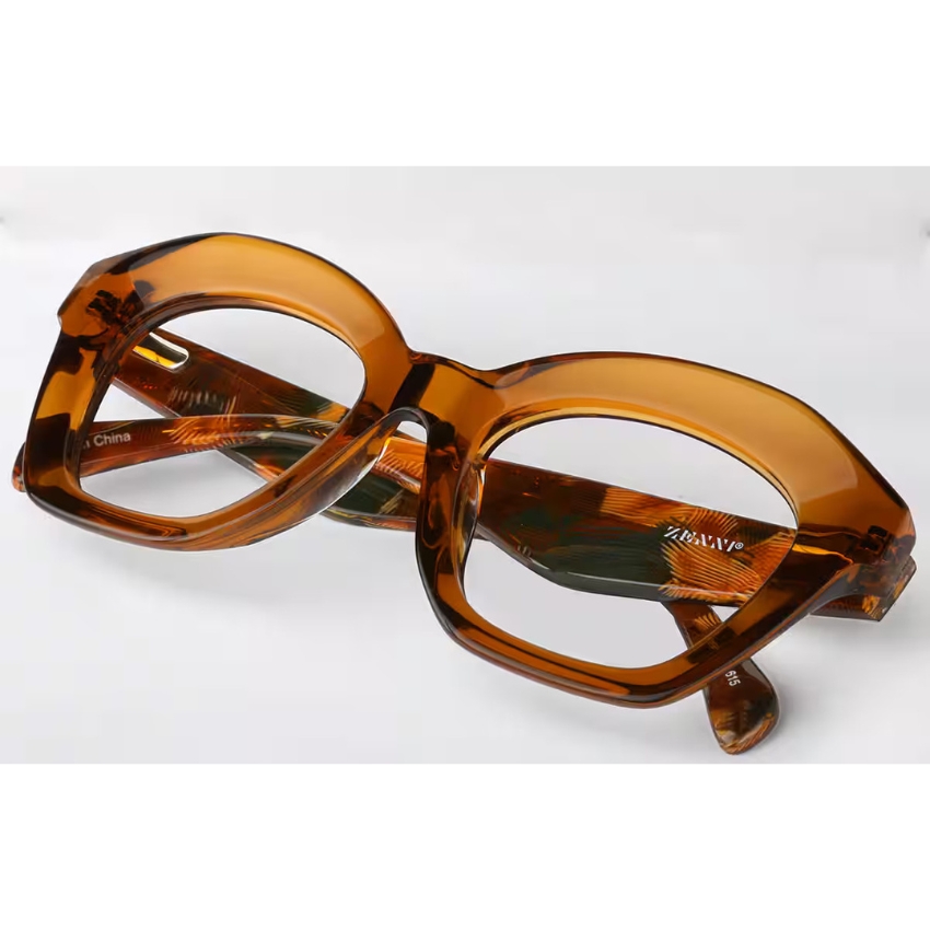 Amber-colored square eyeglasses marked "ZENXIN" on the inside of the temple. Made in China.