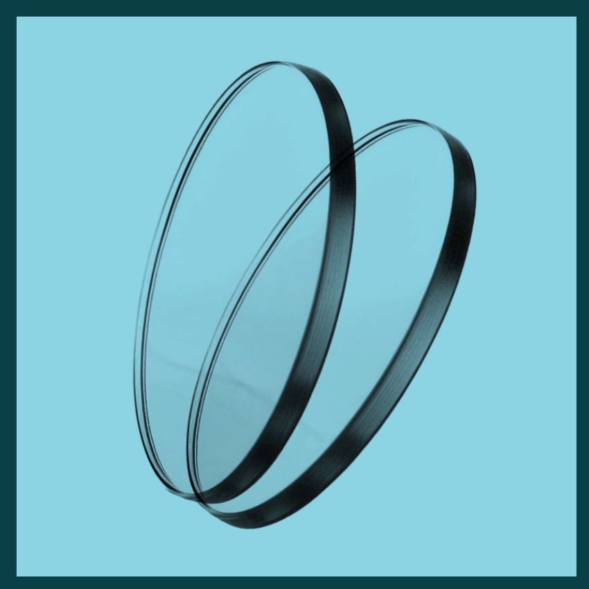 Two clear circular glass filters with dark edges, set against a blue background.