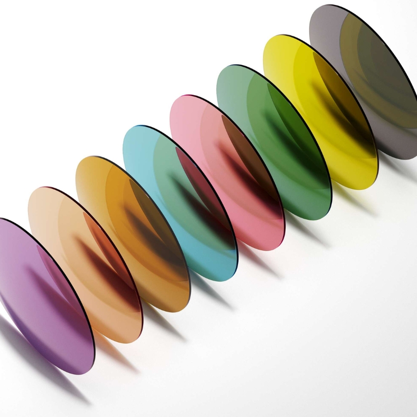 Colorful round tinted lenses arranged diagonally, including purple, orange, blue, pink, green, yellow, and gray.