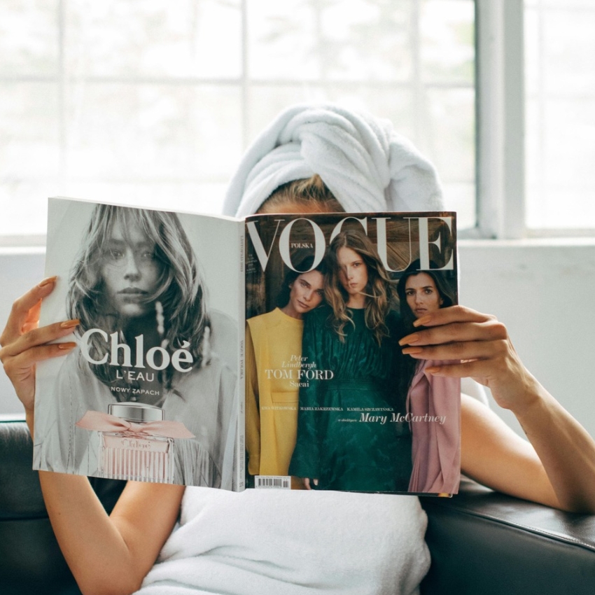 Vogue magazine in hand featuring Chloé L'EAU on the left page and two models on the right cover page