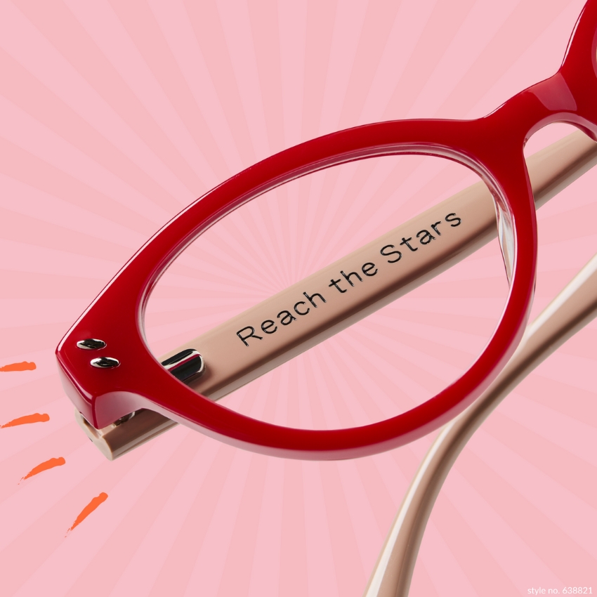 Red eyeglasses frame close-up with the text "Reach the Stars" on the beige temple. Style no. 638821.