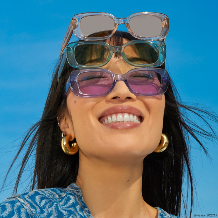 Three stacked sunglasses with different colored lenses worn on the face. Style no. 502719.