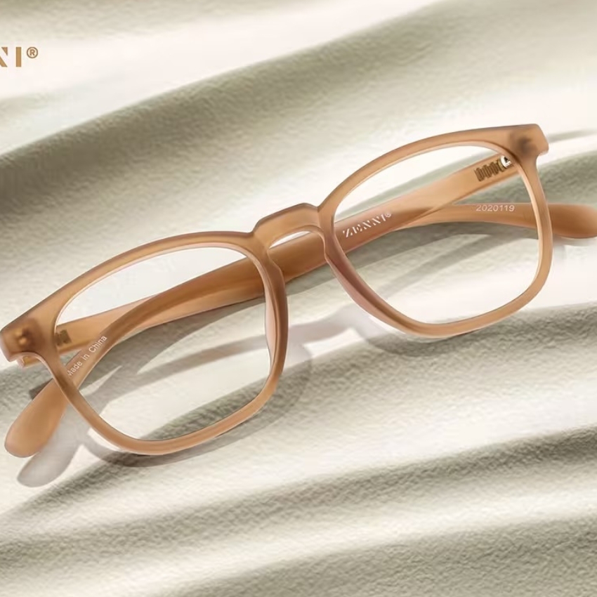 Tan, rectangular eyeglasses with "ZENNI" and "2020119" marked on the frame. "Made in China" on inner arm.