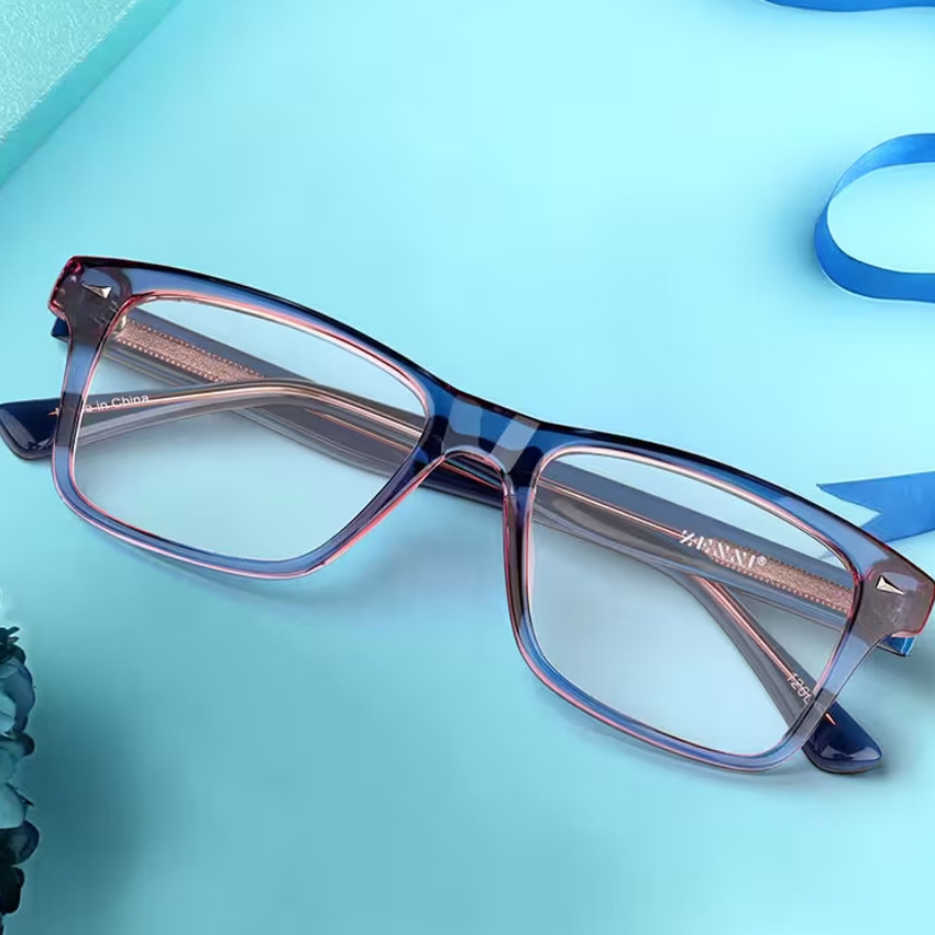 Blue and pink-rimmed glasses with "Made in China" on the inside of the arm.