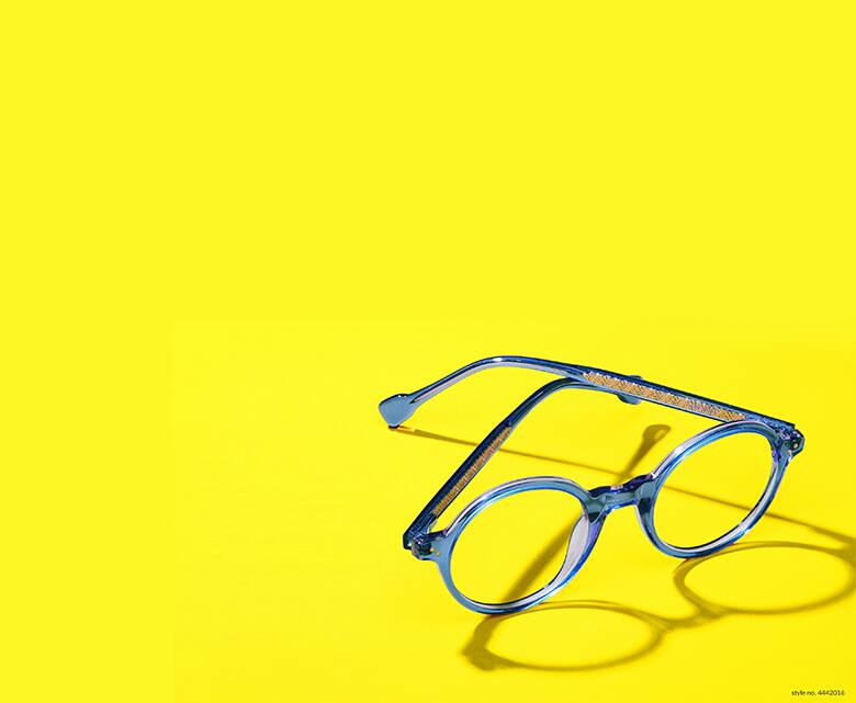 Image of Zenni blue round glasses #4442016 with a bright yellow background.